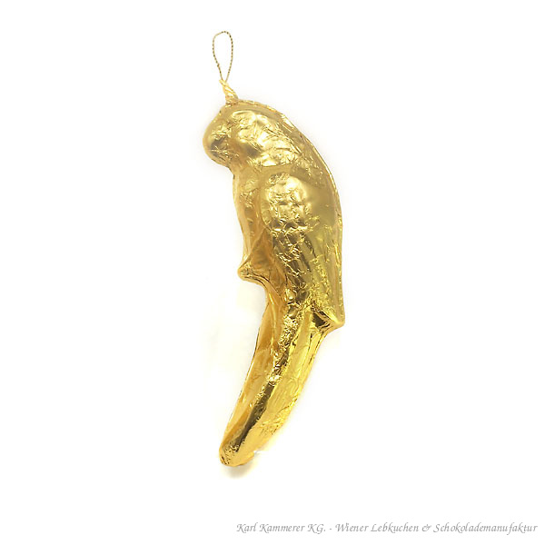 Goldfarben verpackte Schokoladenfigur in Papageienform